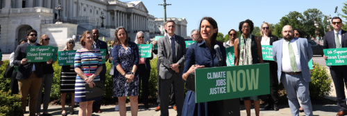 LCV's Tiernan Sittenfeld speaking at a podium in front of the U.S. Capitol.