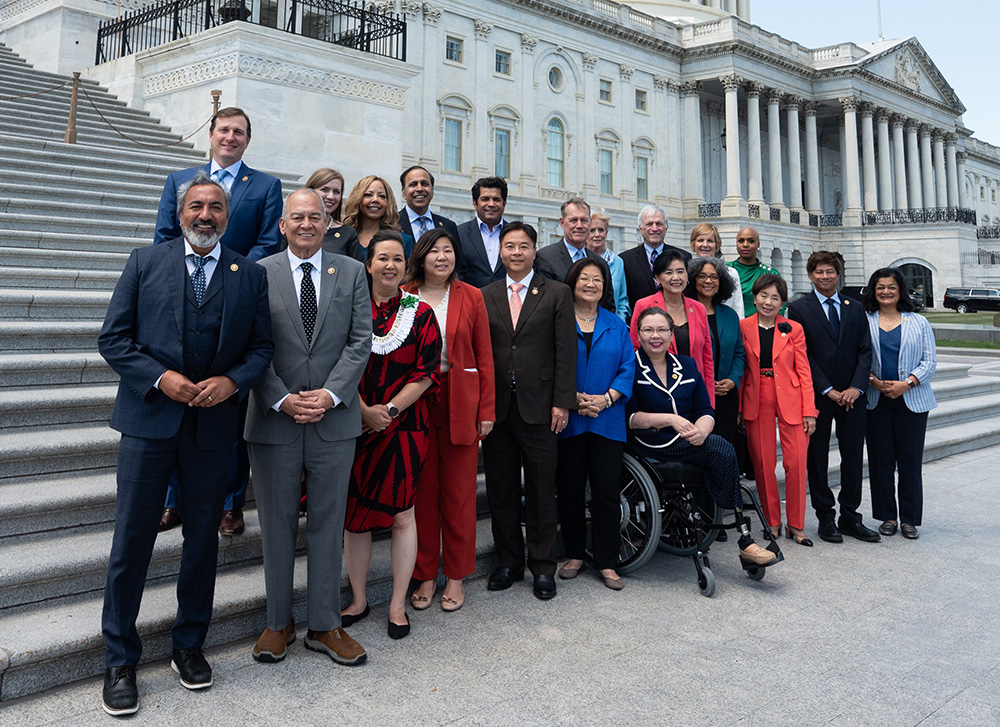 The Congressional Asian Pacific American Caucus (CAPAC) stands in front of the U.S. Capitol Building.