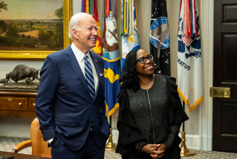 President Joe Biden standing with then-Associate Supreme Court Nominee Ketanji Brown Jackson.