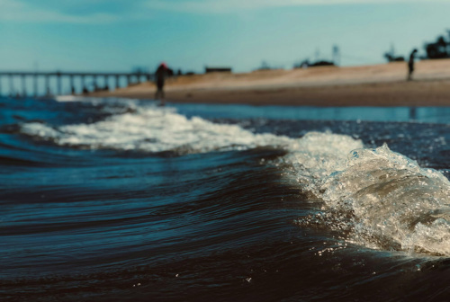 Closeup of a wave splashing ashore on a New Jersey beach.