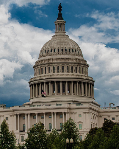 Cloudy skies behind the dome of the US Capitol Building