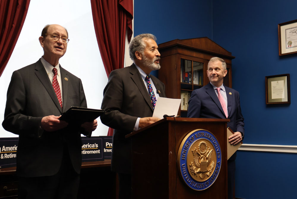 Representative Vargas speaking at podium during an SEC rule press conference.